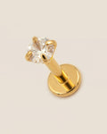Altın renkli 316L cerrahi çelik 6 mm tektaş flatback tragus piercing tasarımı.