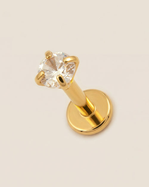 Altın renkli 316L cerrahi çelik 6 mm tektaş flatback tragus piercing tasarımı.