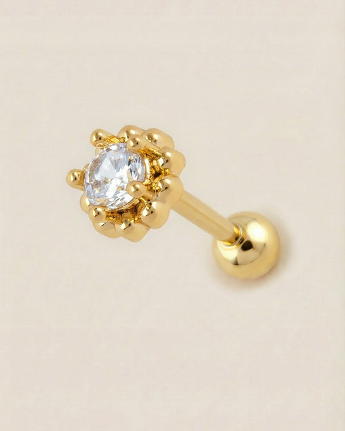 Altın renkli 316L cerrahi çelik çerçeveli zirkon tektaş tragus piercing tasarımı.