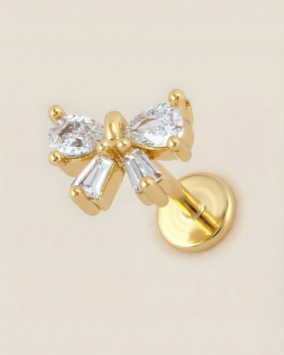 Altın renkli 316L cerrahi çelik damla zirkon taşlı kurdele flatback piercing.