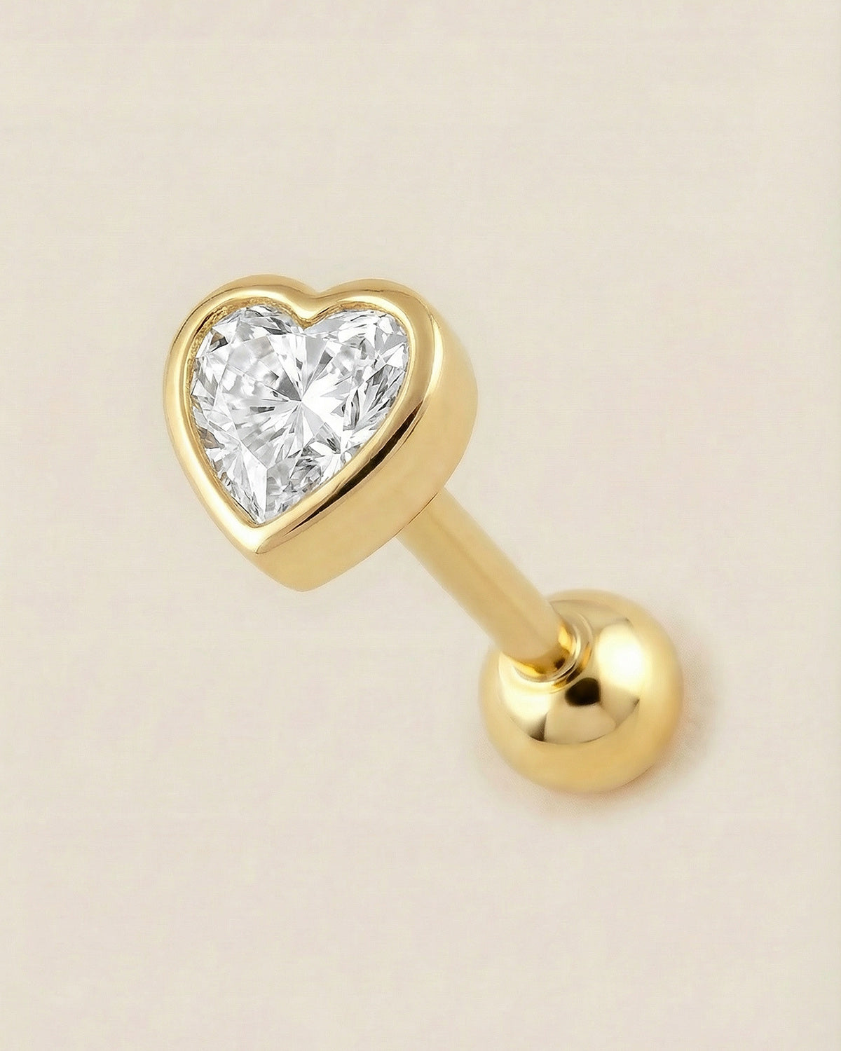 Altın renkli 316L cerrahi çelik kalın çerçeveli kalp zirkon taşlı tragus piercing tasarımı.