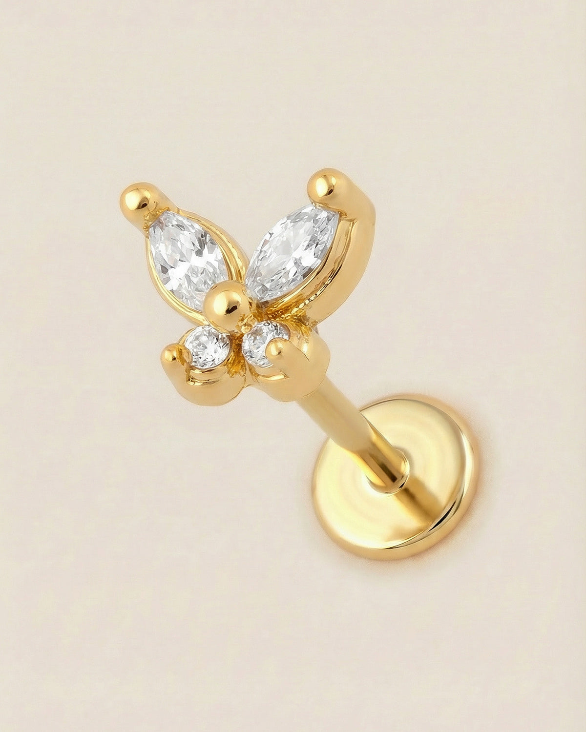 Altın renkli 316L cerrahi çelik minimal kelebek formlu flatback piercing tasarımı.