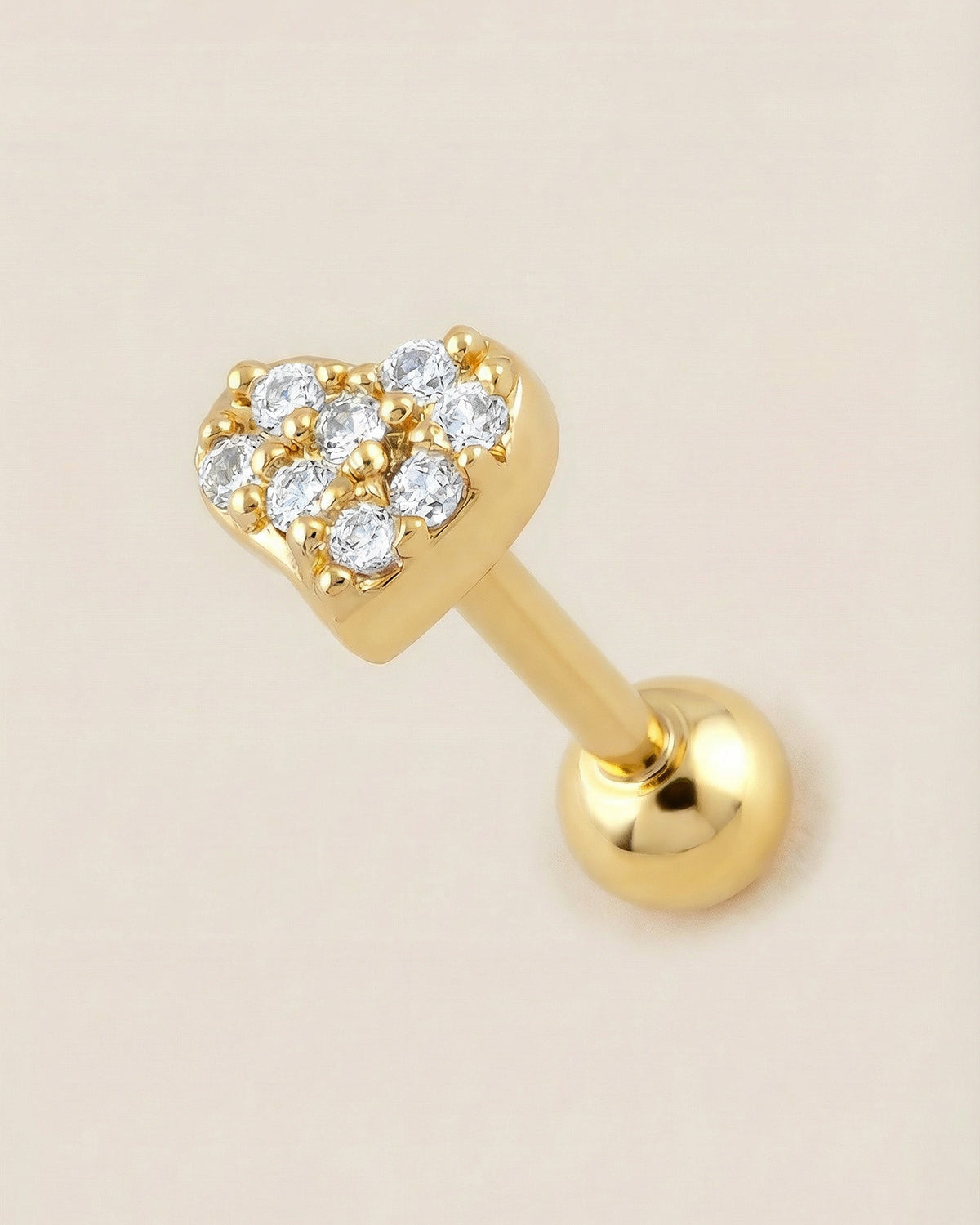 Altın renkli 316L cerrahi çelik pave zirkon taşlı kalp tragus piercing tasarımı.
