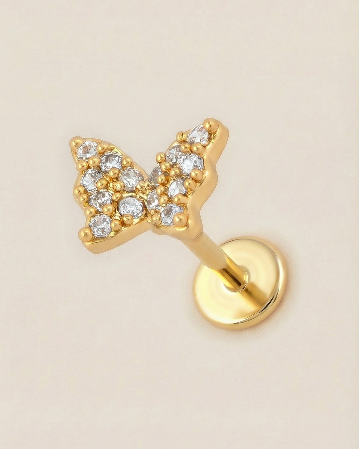 Altın renkli 316L cerrahi çelik pave zirkon taşlı kelebek flatback piercing.