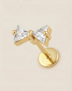 Altın renkli 316L cerrahi çelik üçgen kesim zirkon taşlı kurdele flatback piercing.