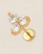 Altın renkli 316L cerrahi çelik üçlü taşlı trinity flatback piercing tasarımı.