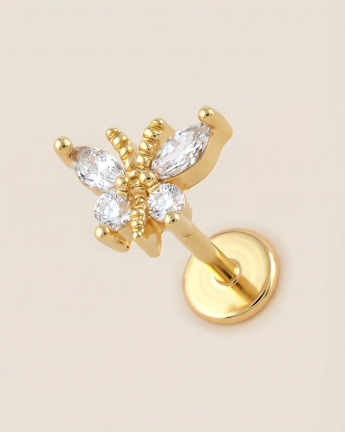 Altın renkli 316L cerrahi çelik zirkon taşlı kelebek flatback piercing tasarımı.