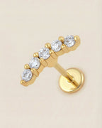 Altın renkli 316L cerrahi çelik zirkon taşlı minimal kavisli flatback piercing.