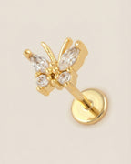 Altın renkli 316L cerrahi çelik zirkon taşlı minimal kelebek flatback piercing tasarımı.