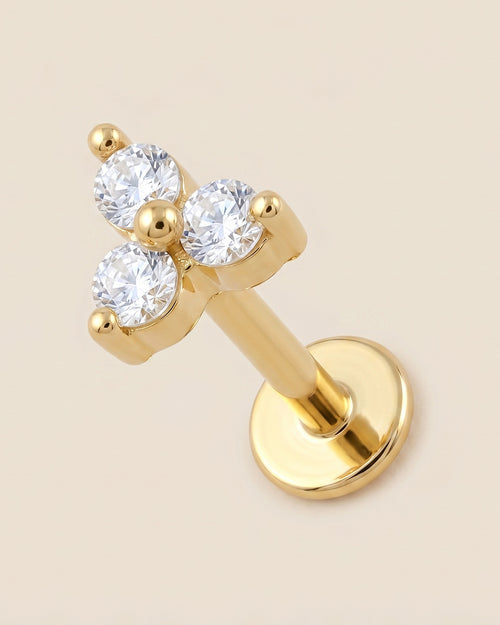 Altın renkli 316L cerrahi çelik 3 taşlı flatback piercing tasarımı.