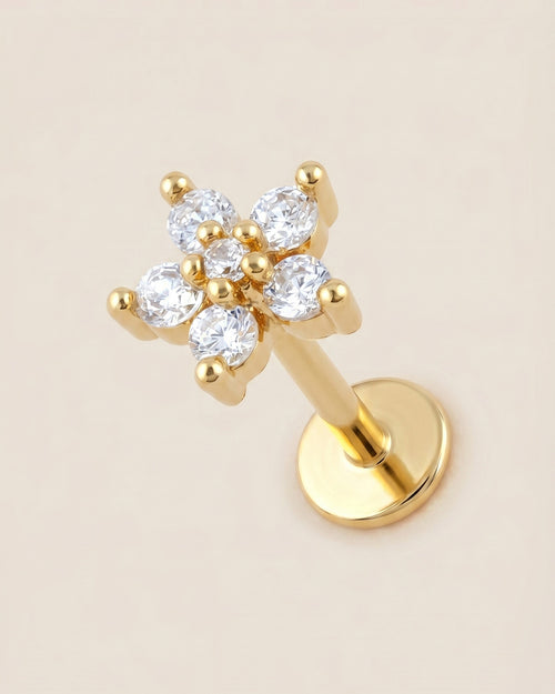 Altın renkli 316L cerrahi çelik çiçek formlu flatback piercing tasarımı.