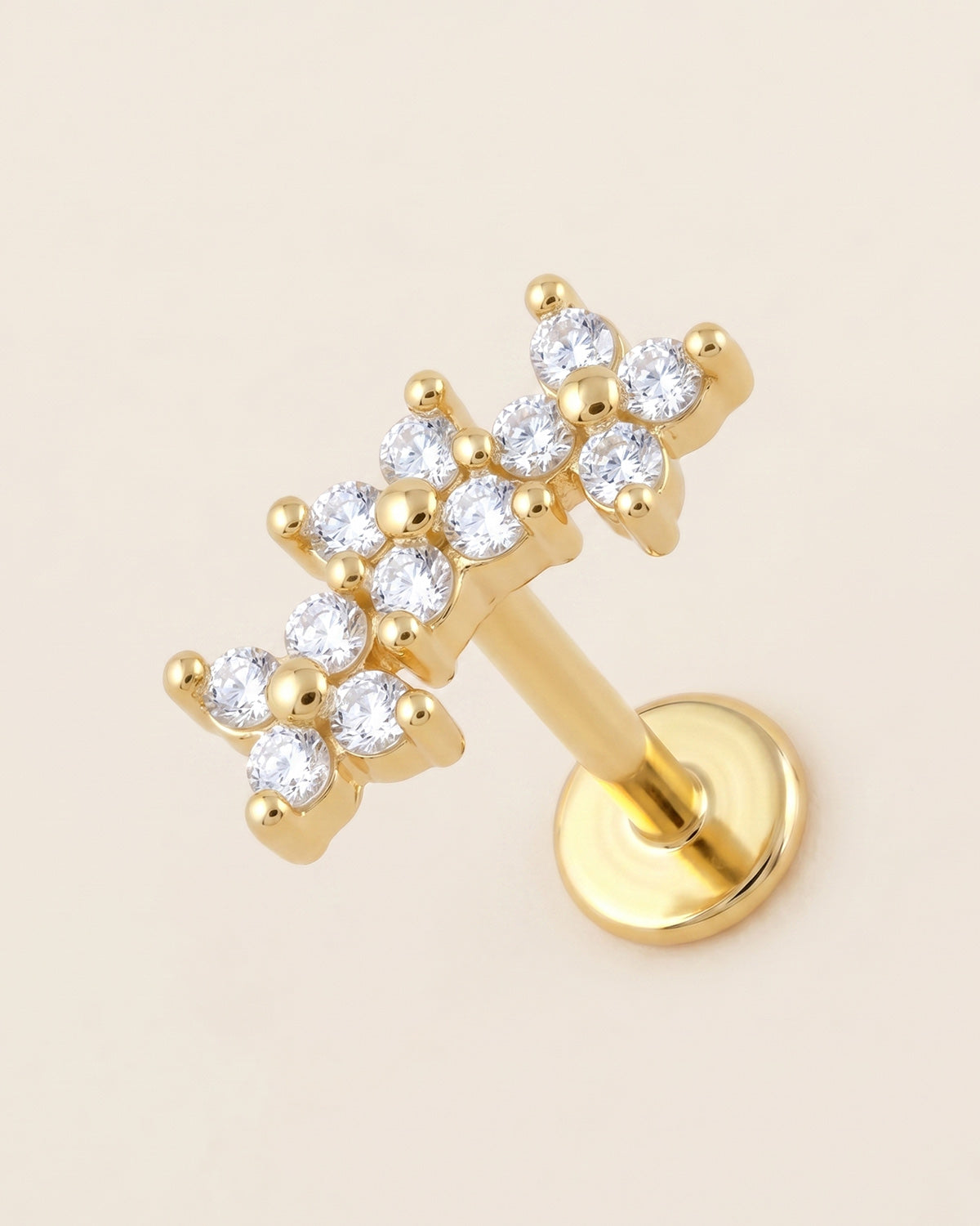Altın renkli 316L cerrahi çelik kavisli 3 çiçek figürlü flatback piercing tasarımı.