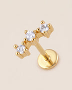Altın renkli 316L cerrahi çelik kavisli 3 taşlı flatback piercing tasarımı.
