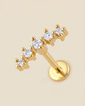 Altın renkli 316L cerrahi çelik kavisli 5 zirkon taşlı flatback piercing tasarımı.