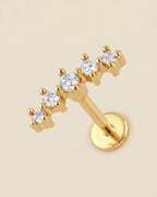 Altın renkli 316L cerrahi çelik kavisli 5 zirkon taşlı flatback piercing tasarımı.