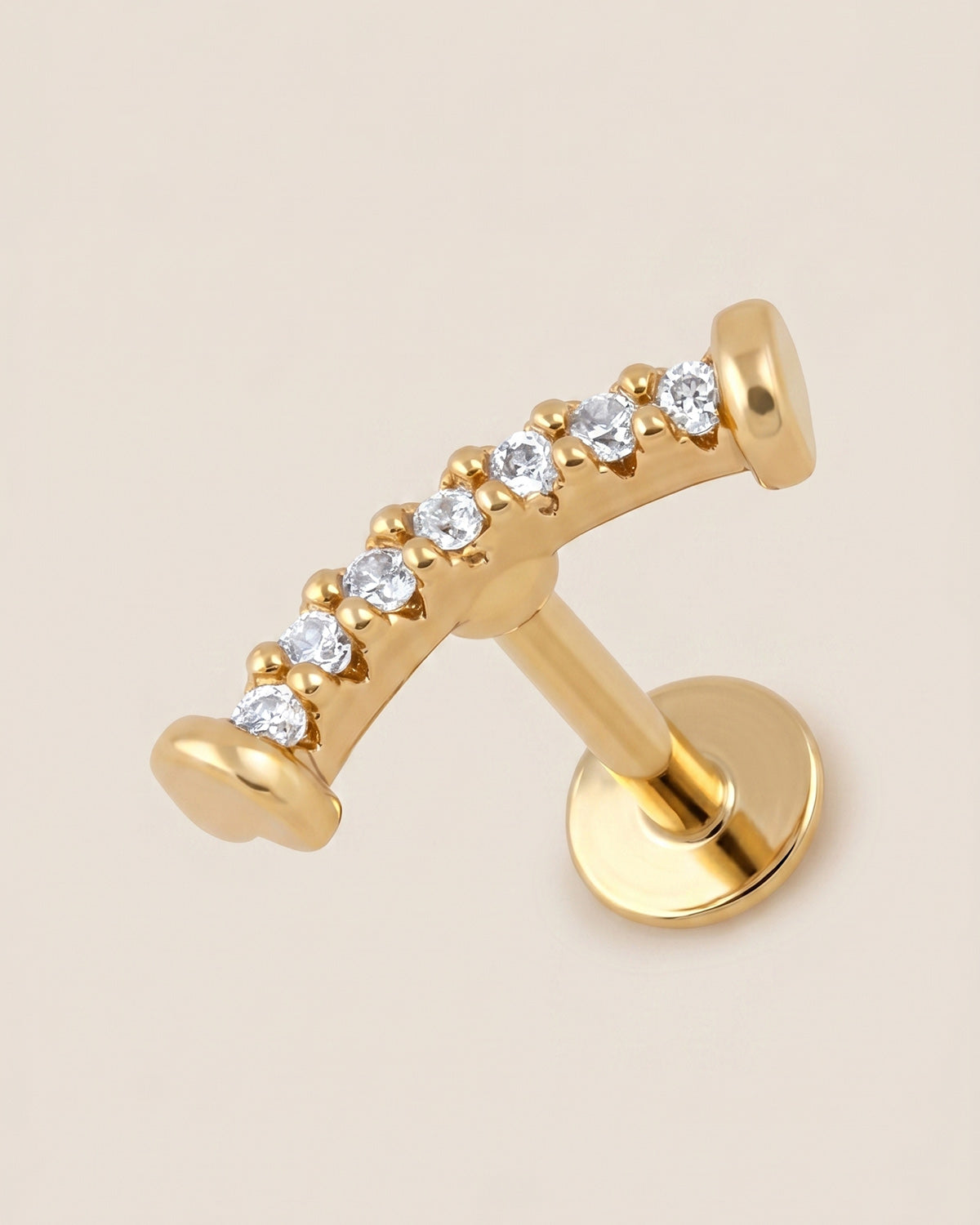 Altın renkli 316L cerrahi çelik kavisli flatback piercing tasarımı.