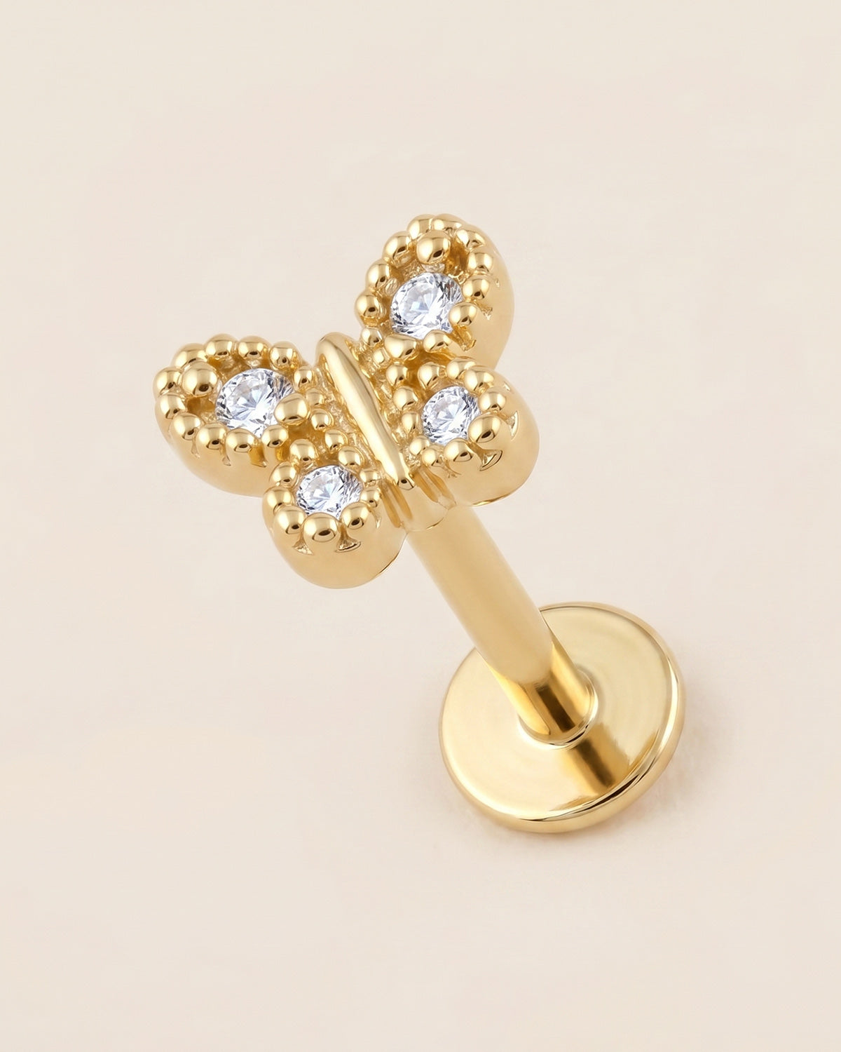 Altın renkli 316L cerrahi çelik kelebek figürlü flatback piercing tasarımı.
