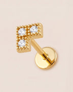 Altın renkli 316L cerrahi çelik V formlu flatback piercing tasarımı.