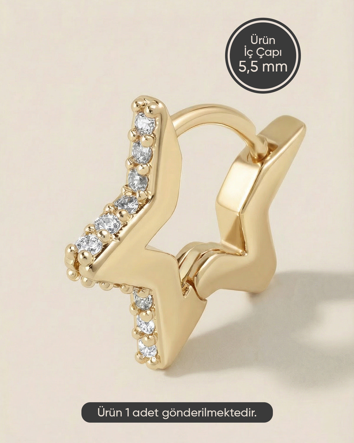 Altın renkli çelik yıldız formlu zirkon taşlı halka piercing.