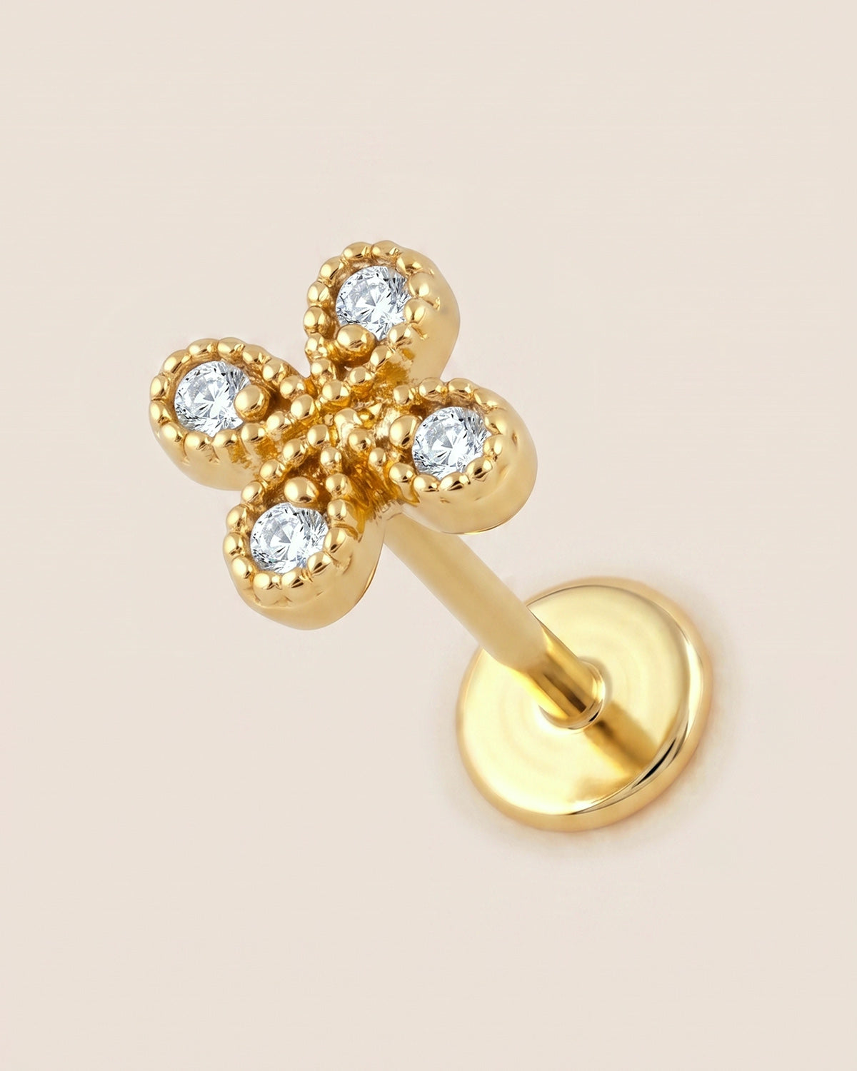 Altın renkli 316L cerrahi çelik zirkon taşlı çiçek flatback piercing tasarımı.
