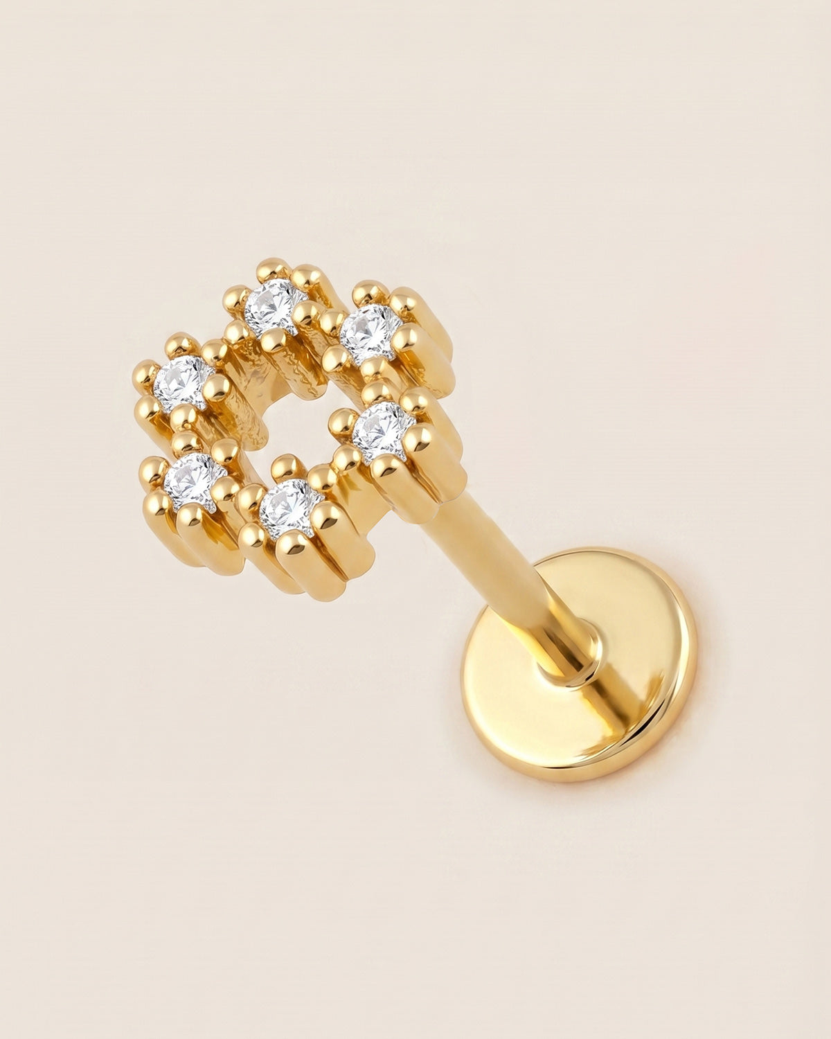 Altın renkli 316L cerrahi çelik zirkon taşlı halo flatback piercing tasarımı.
