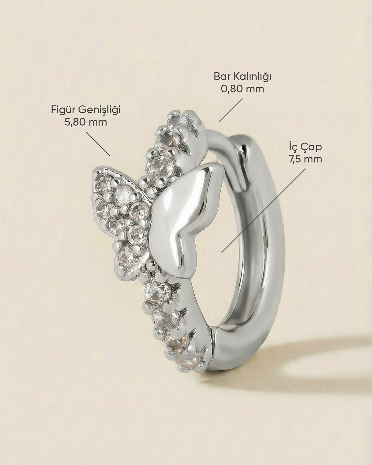 Gümüş renkli çelik asimetrik kelebek zirkon taşlı halka piercingin ölçüleri.