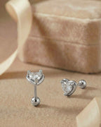 Günlük kullanıma uygun minimal kalp tasarımlı gümüş renkli cerrahi çelik piercing.