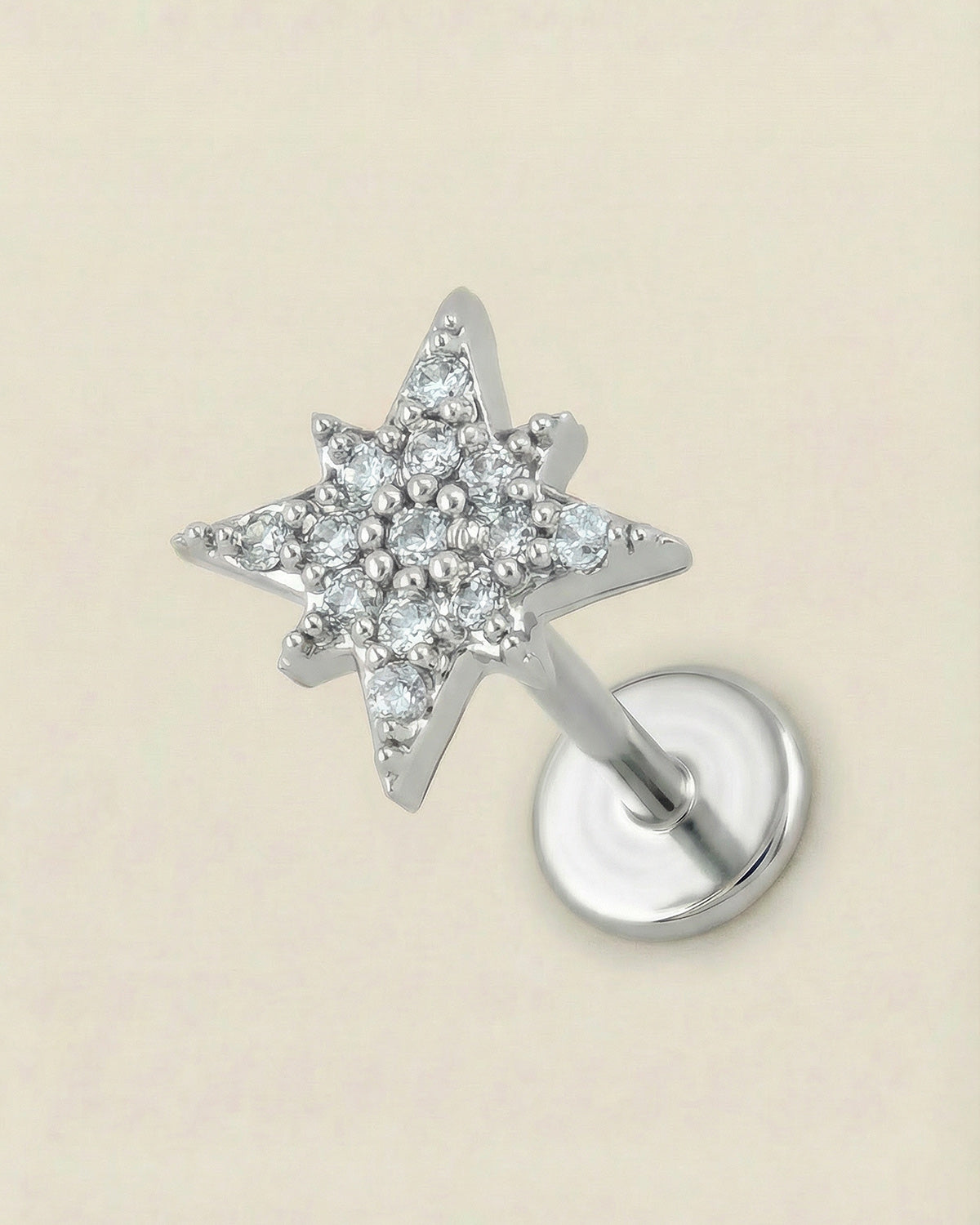 Gümüş renkli 316L cerrahi çelik zirkon taşlı kutup yıldızı figür flatback piercing.
