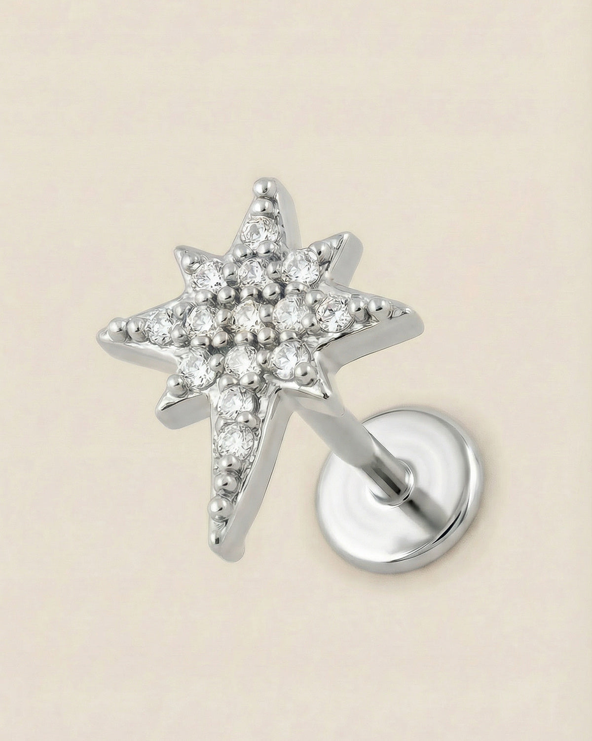 Gümüş renkli 316L cerrahi çelik zirkon taşlı kutup yıldızı flatback piercing.