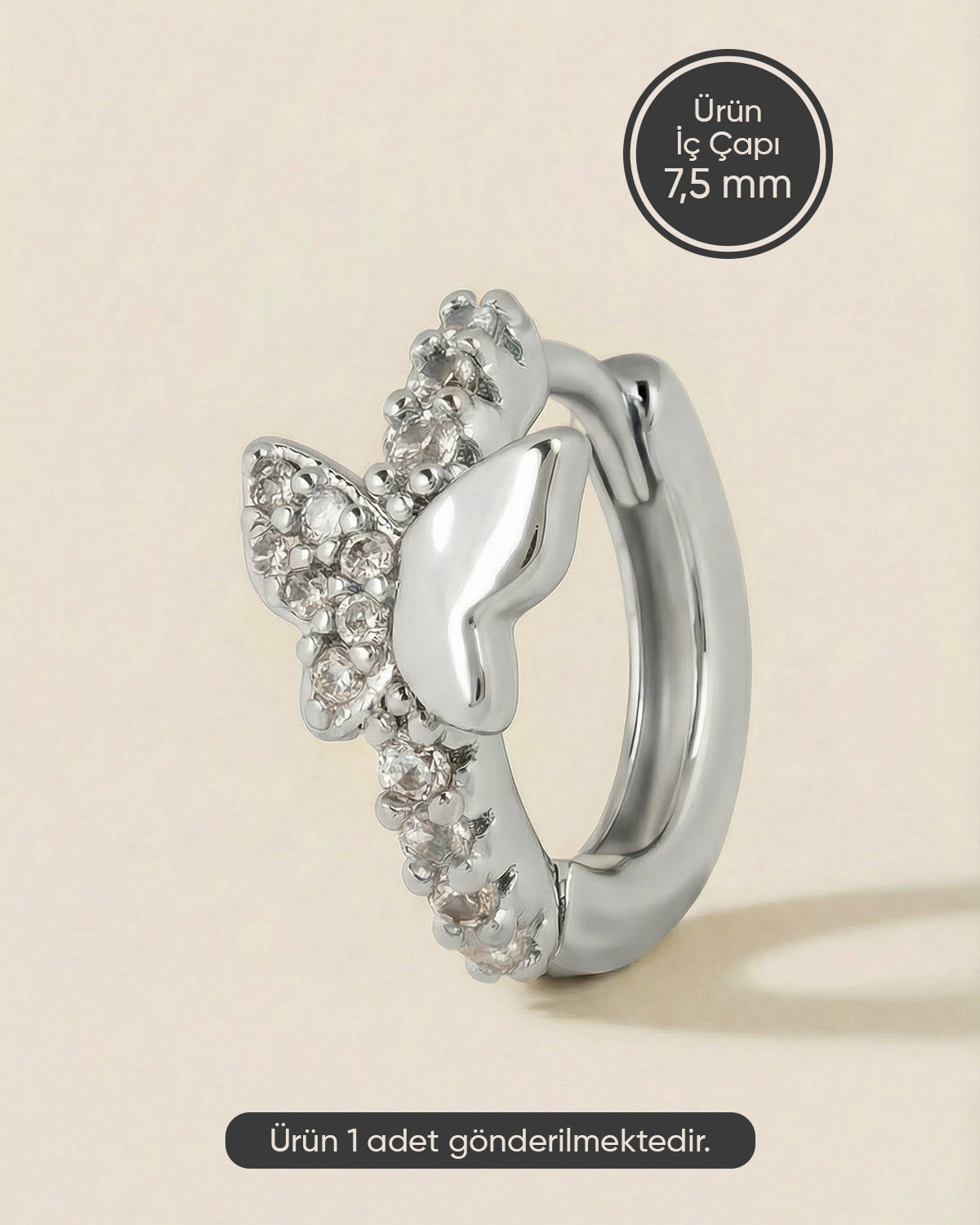 Gümüş renkli 316L cerrahi çelik asimetrik kelebek zirkon taşlı halka piercing tasarımı.