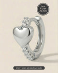 Gümüş renkli 316L cerrahi çelik bombeli kalp figürü zirkon taşlı halka piercing tasarımı.
