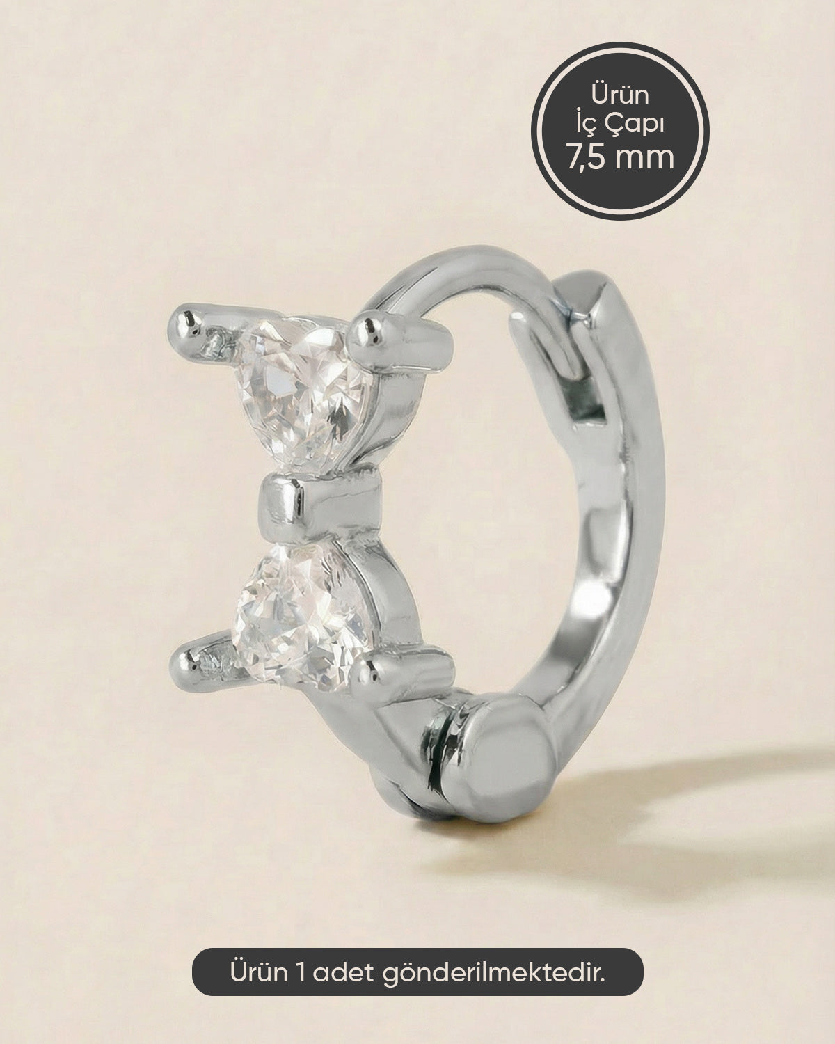 Gümüş renkli 316L cerrahi çelik fiyonk zirkon taşlı halka piercing tasarımı.