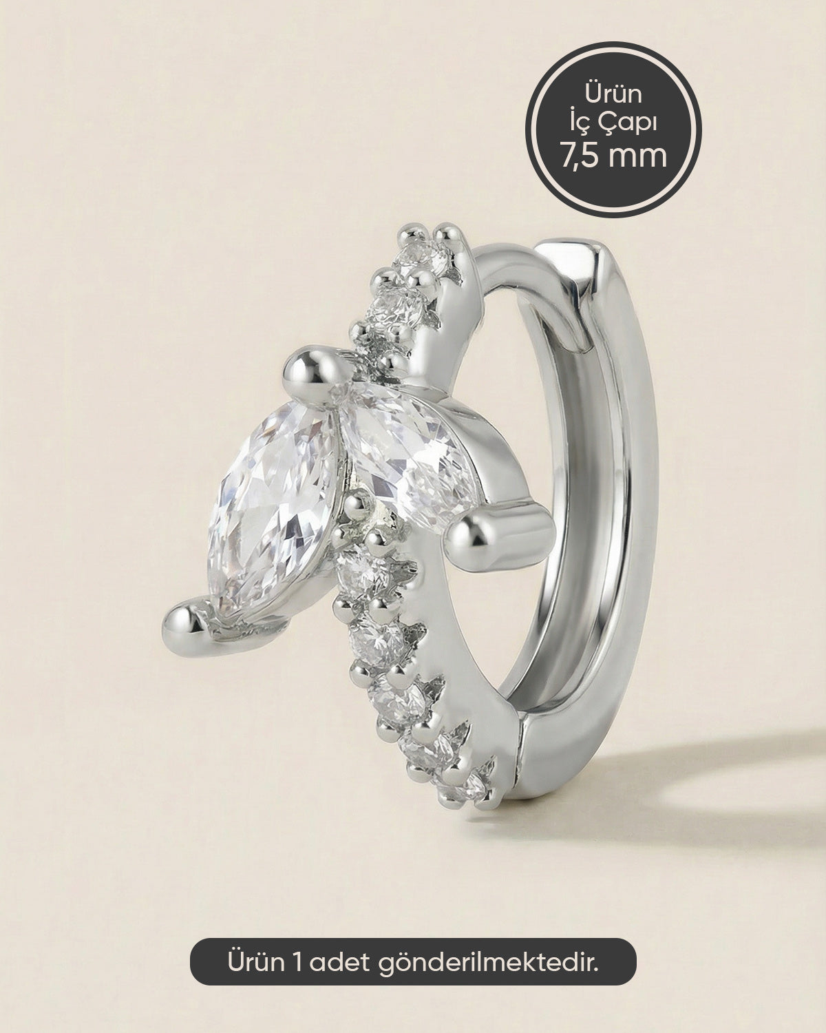 Gümüş renkli 316L cerrahi çelik kanat formlu zirkon taşlı halka piercing tasarımı.