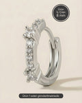 Gümüş renkli 316L cerrahi çelik sıralı küme zirkon taşlı halka piercing tasarımı.