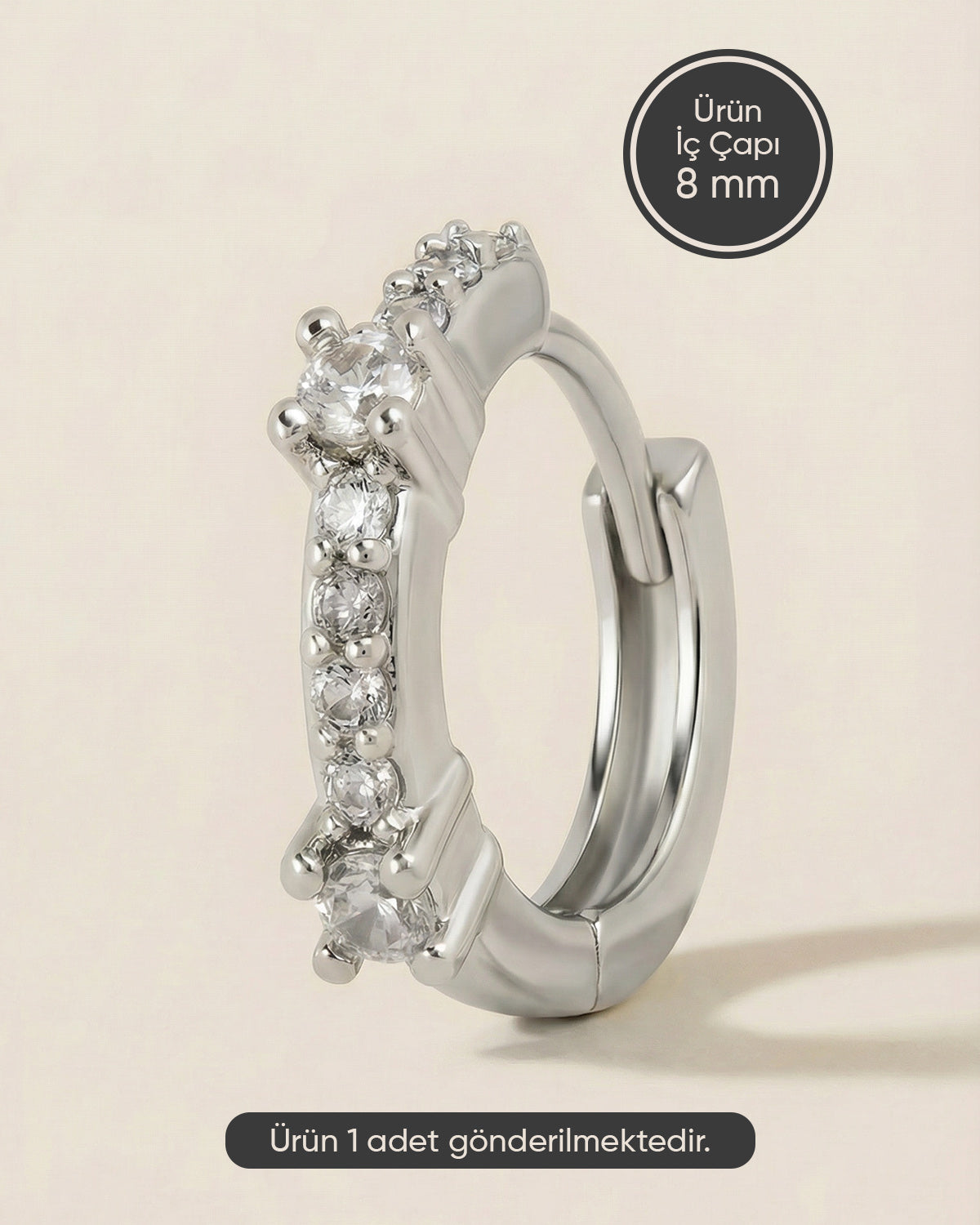Gümüş renkli 316L cerrahi çelik sıralı küme zirkon taşlı halka piercing tasarımı.