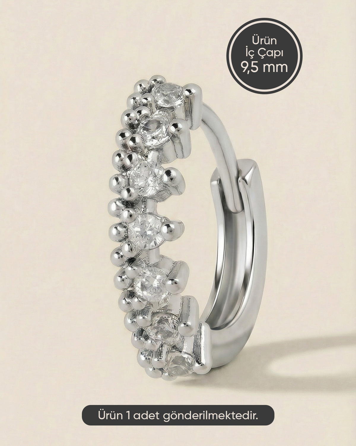 Gümüş renkli 316L cerrahi çelik taç formlu zirkon taşlı halka piercing tasarımı.