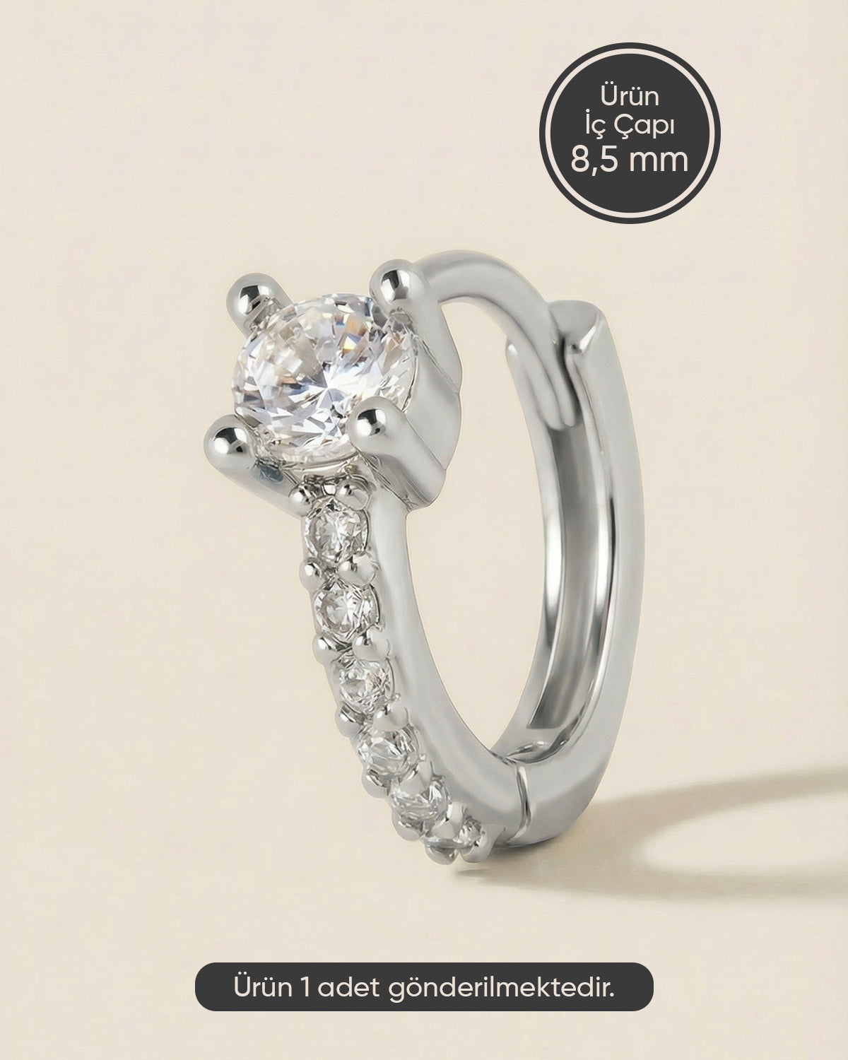 Gümüş renkli 316L cerrahi çelik tektaş ve çoklu zirkon taşlı halka piercing tasarımı.