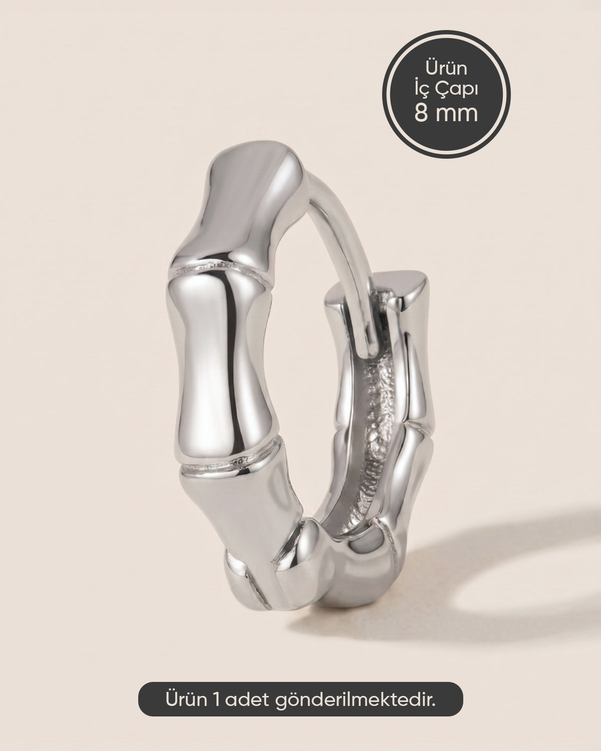 Gümüş renkli cerrahi çelik taşsız bambu formlu halka piercing tasarımı.