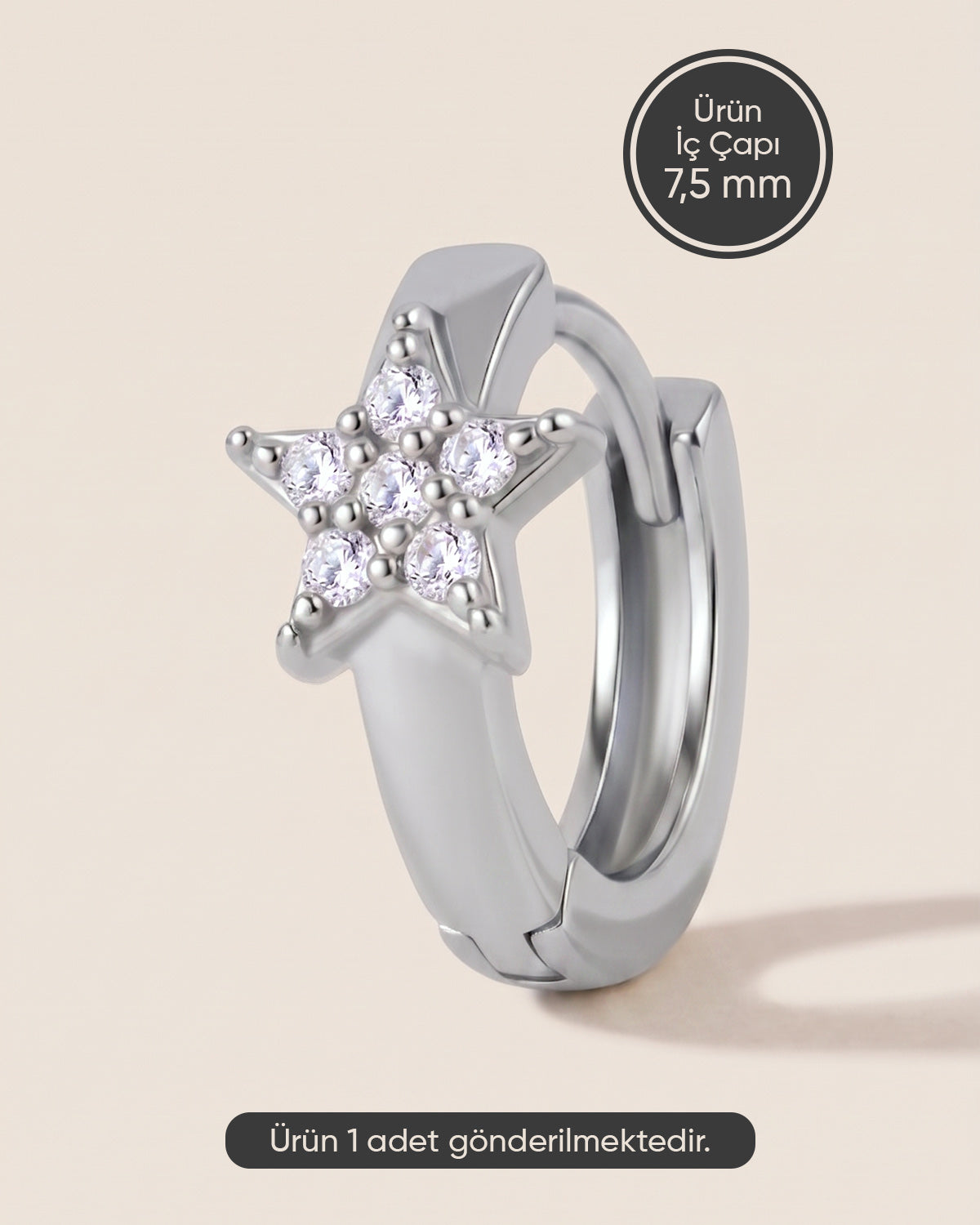 Gümüş renkli cerrahi çelik zirkon taşlı yıldız figürlü 7,5 mm halka piercing tasarımı.